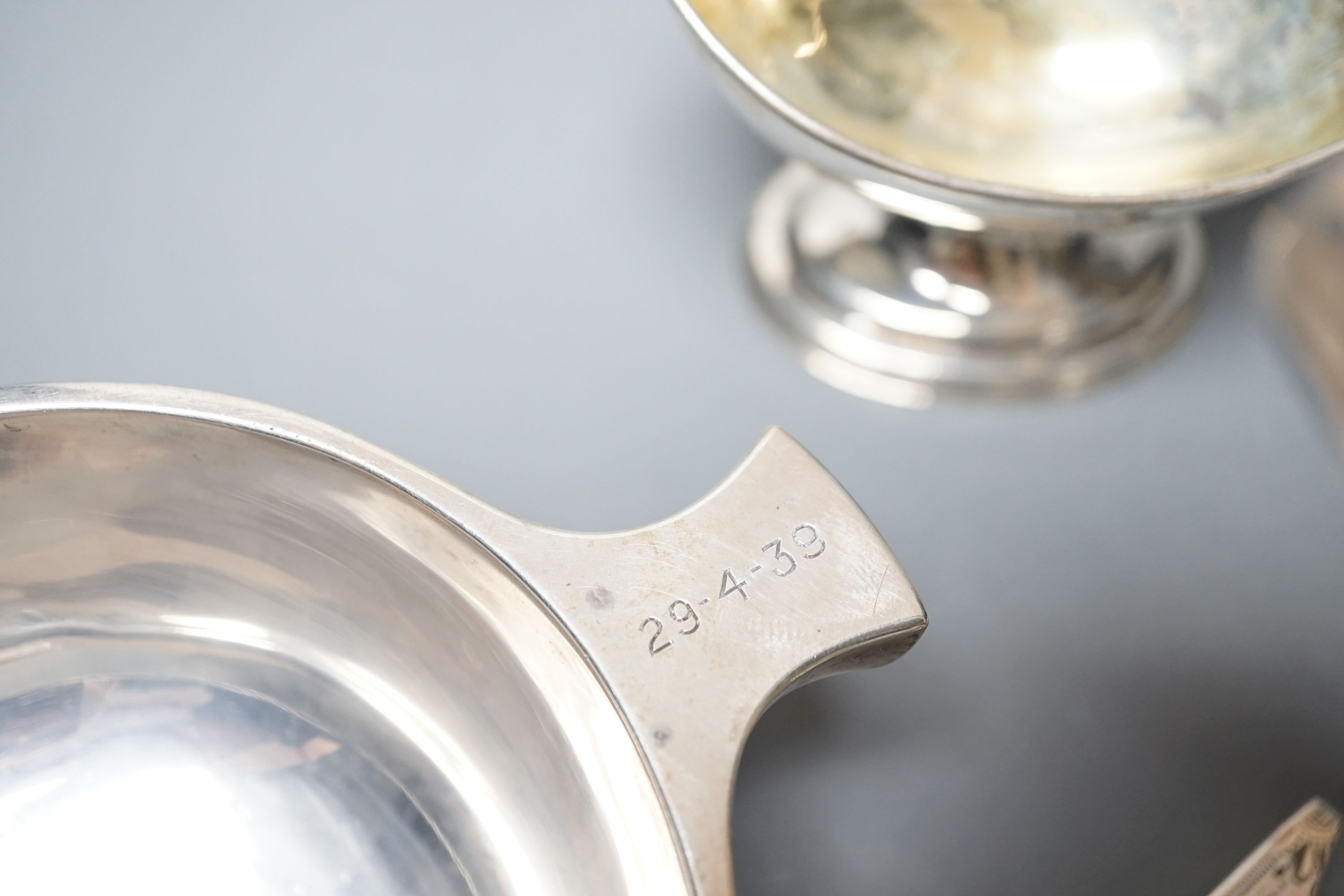 A mixed collection of silver to include a Scottish quaich, a pair of George III boat shaped salts, a George III silver helmet shaped cream jug and a pierced boat-shaped bowl, 17oz.